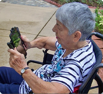 Older adult using Pad Go Round outdoors