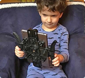 Child holding a tablet with Pad Go Round