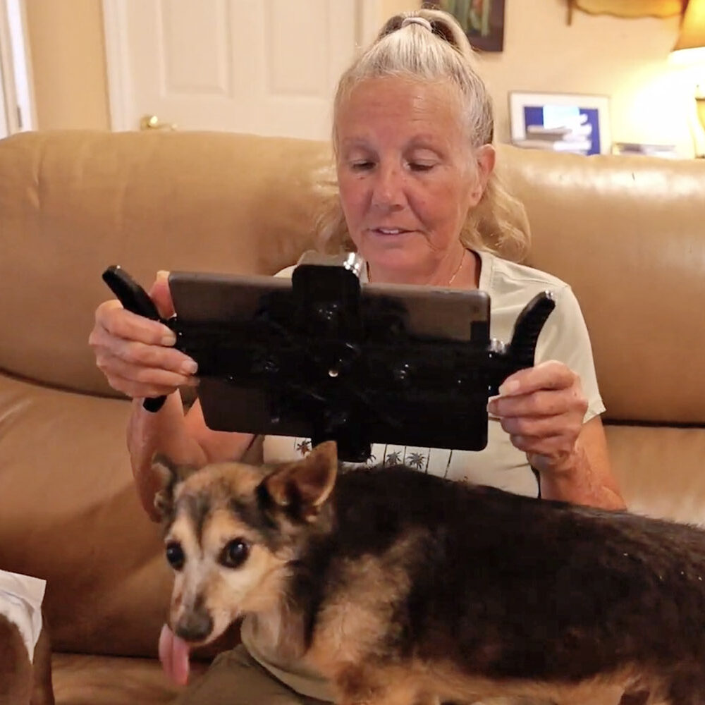 Dog at home near a Pad-Go-Round tablet holder